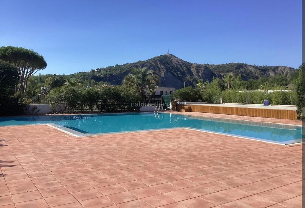 Photo de Bel appartement T3 avec jardin privatif et piscine commune